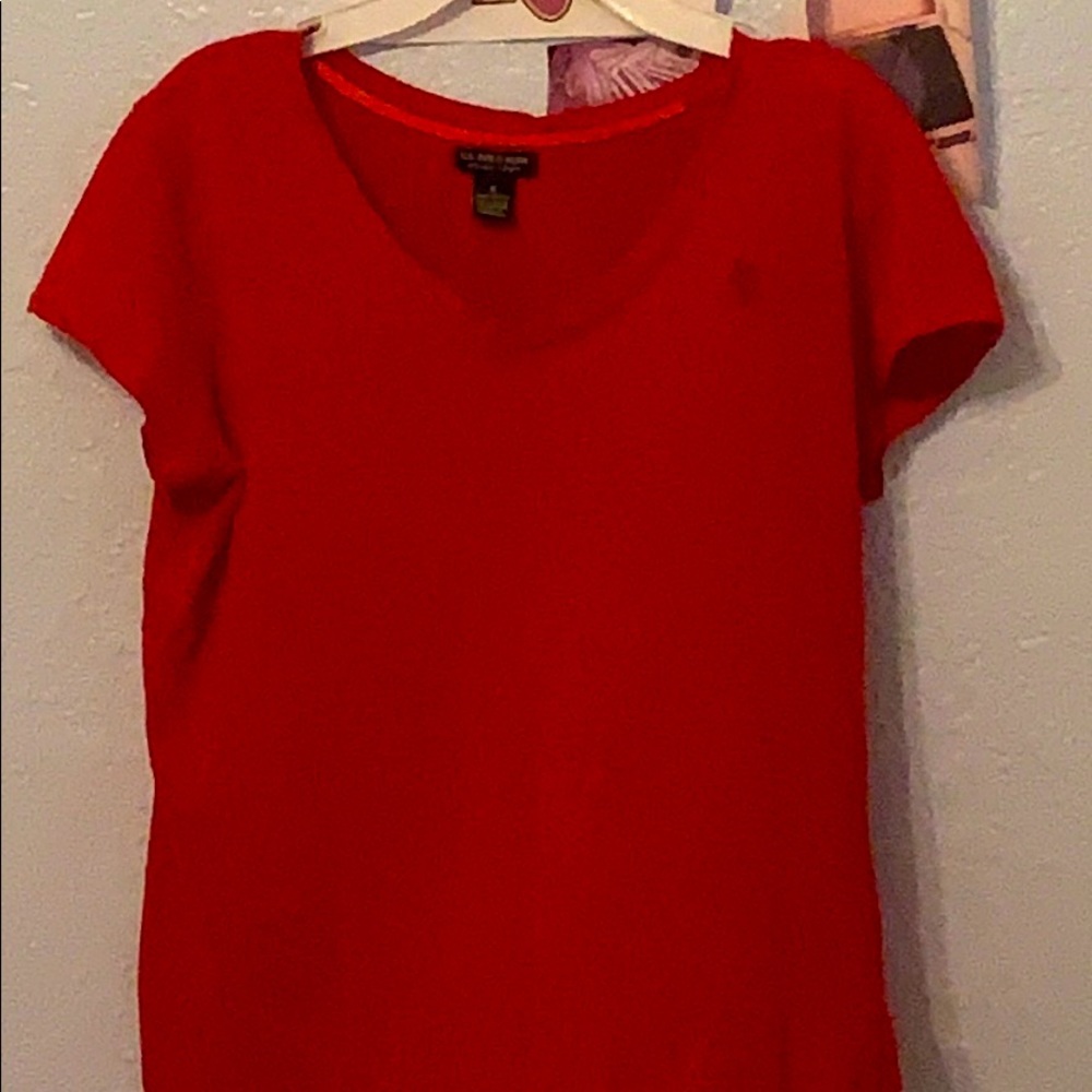 A red polo tee